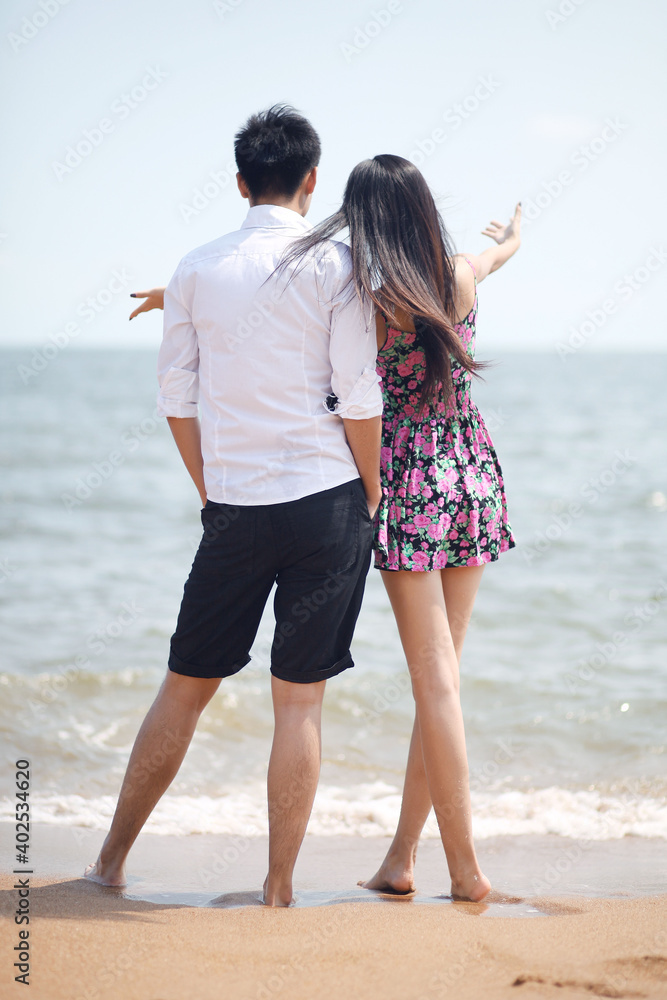 Couple standing on seaside