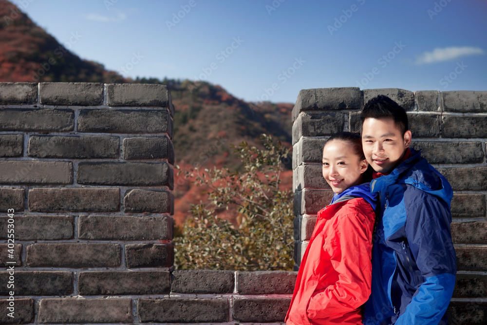 Young couples take pictures in the Great Wall Tourism