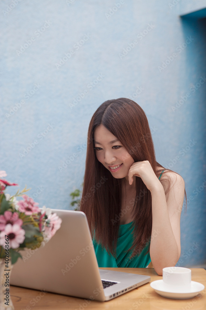 A women working in front of computers