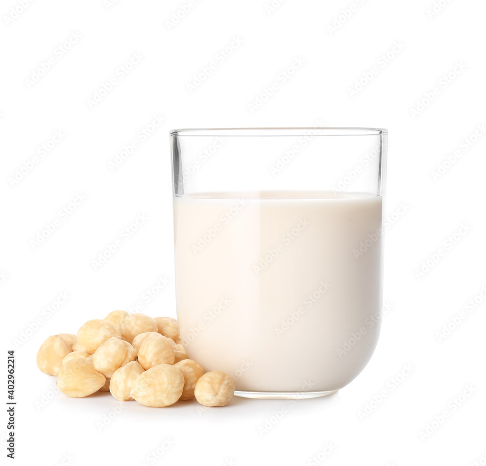 Glass of hazelnut milk isolated on white background