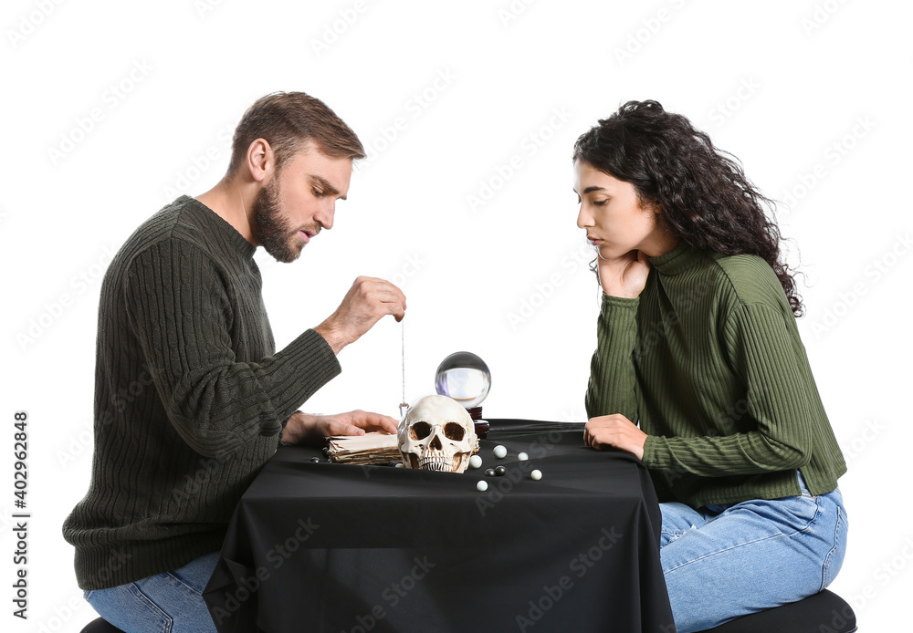 Clairvoyant telling client her future against white background