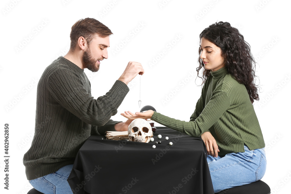 Clairvoyant telling client her future against white background