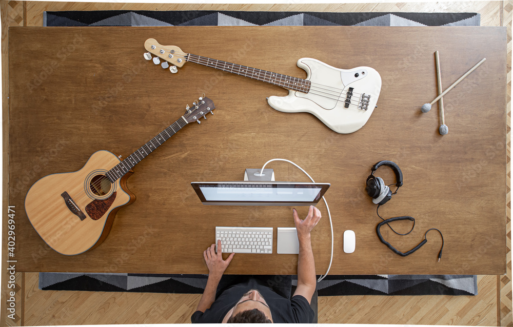 Top view of musician in the process of recording music in the studio.