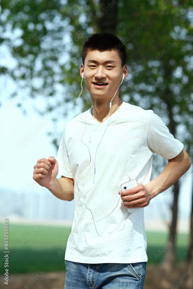 The young man running in the park 