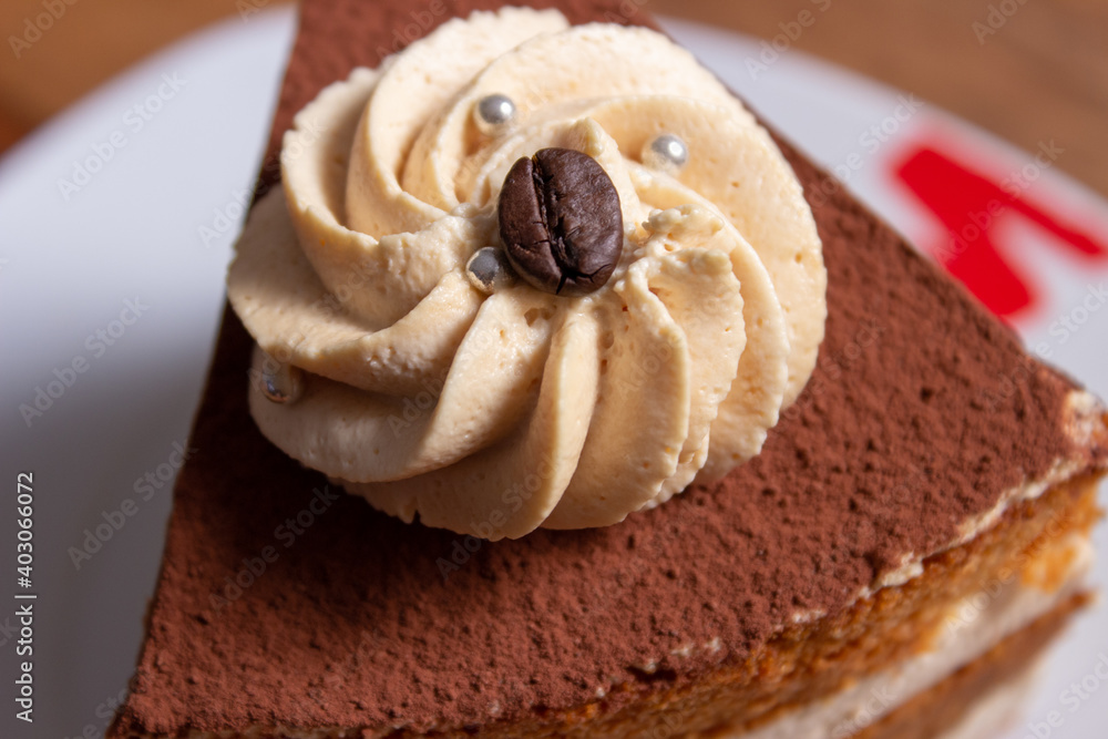 caramel toffee cake with cocoa and coffee beans