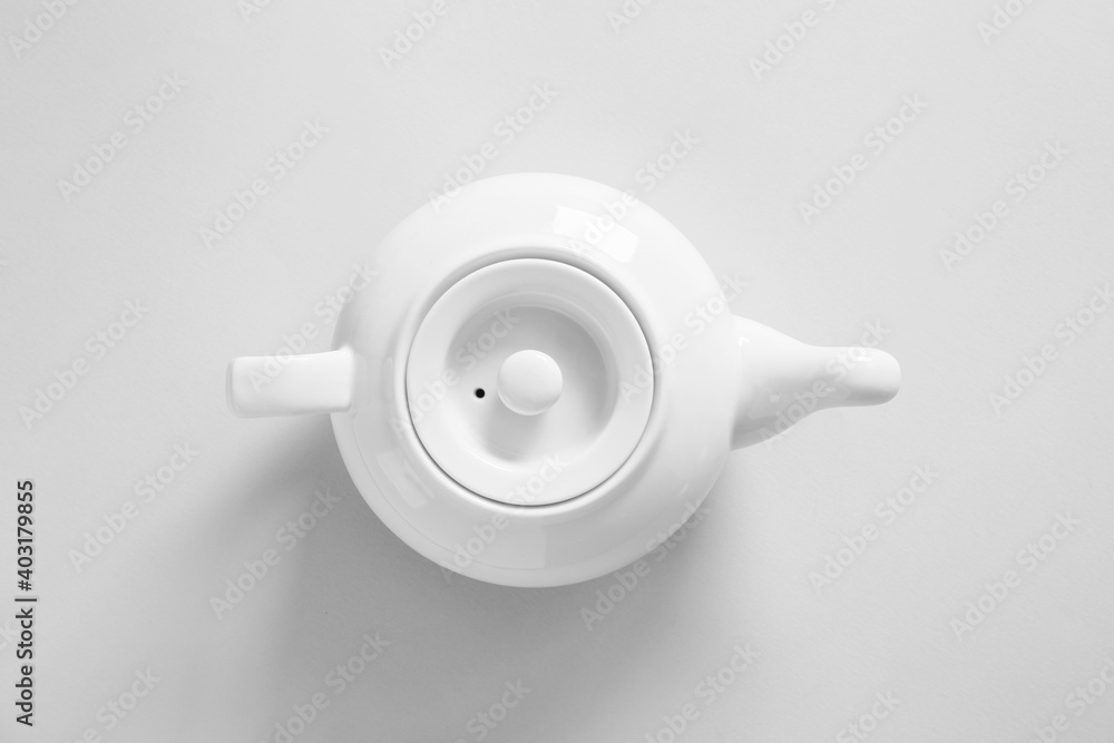 Teapot on grey background, top view