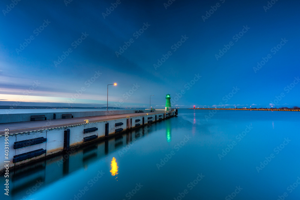 Lighthouse on the west breakwater in Nowy Port at dusk, Gdańsk. Poland