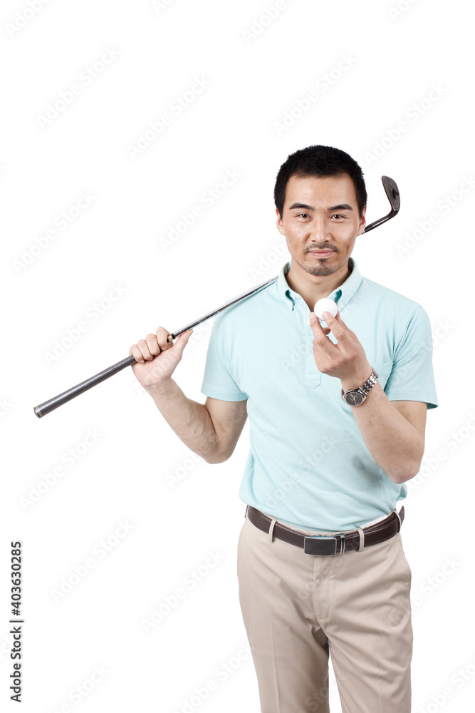 Young man wearing a suit and golfing