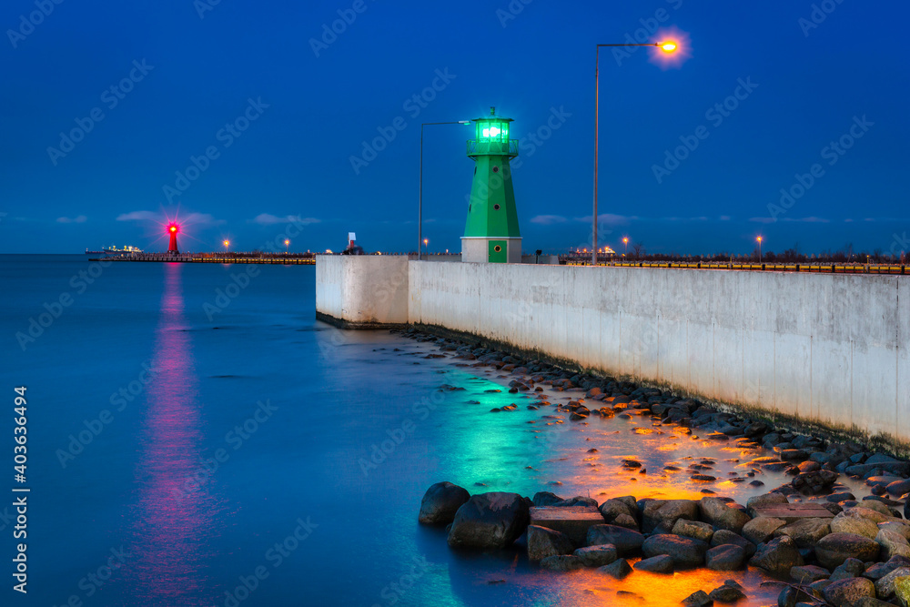 Lighthouse on the west breakwater in Nowy Port at dusk, Gdańsk. Poland