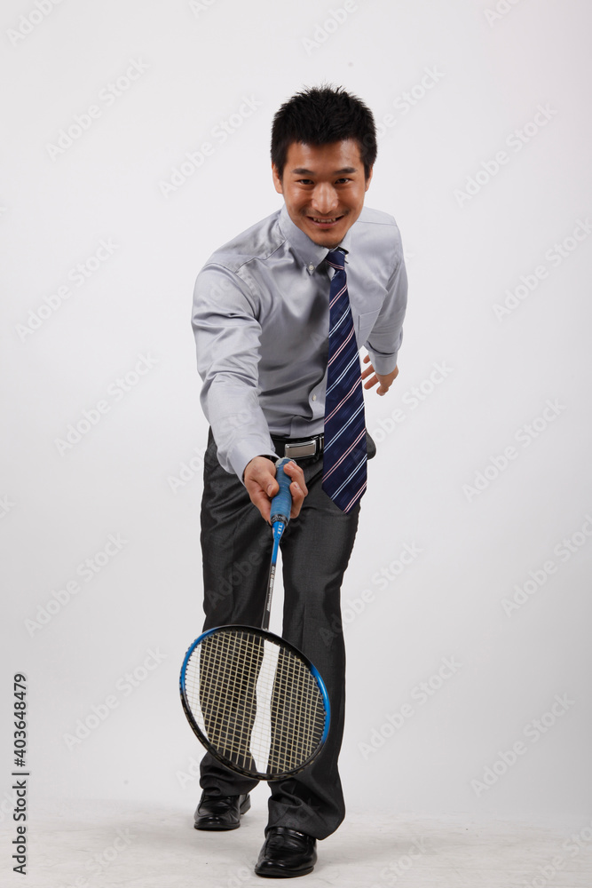 A business exercising with man playing badminton