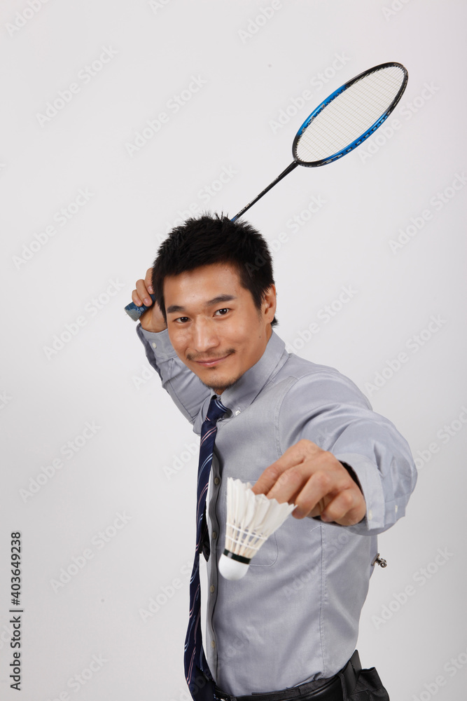 A business exercising with man playing badminton 