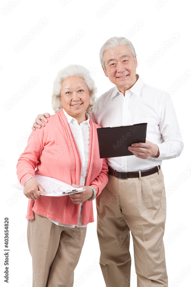 The happy old senior couple holding questionnaire 