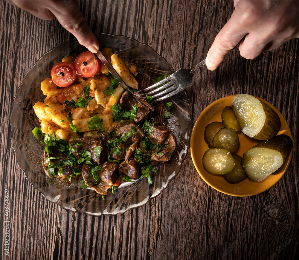 Stewed potatoes with chicken stomach with pickled cucumbers