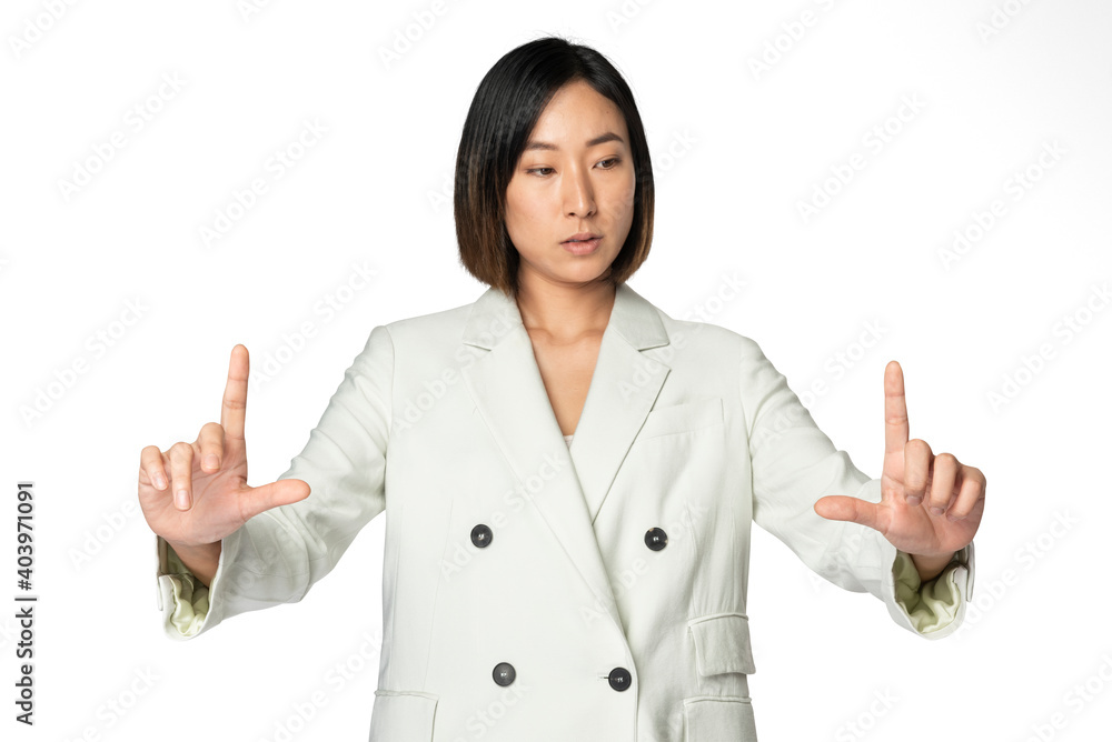 Asian businesswoman touching virtual screen