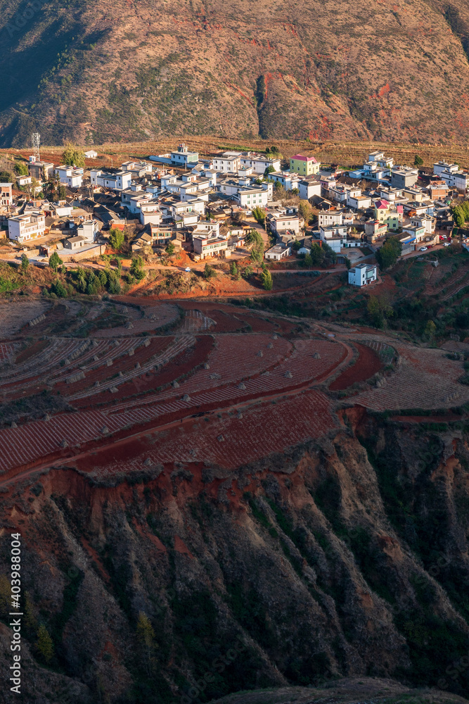 village on hills in sunset