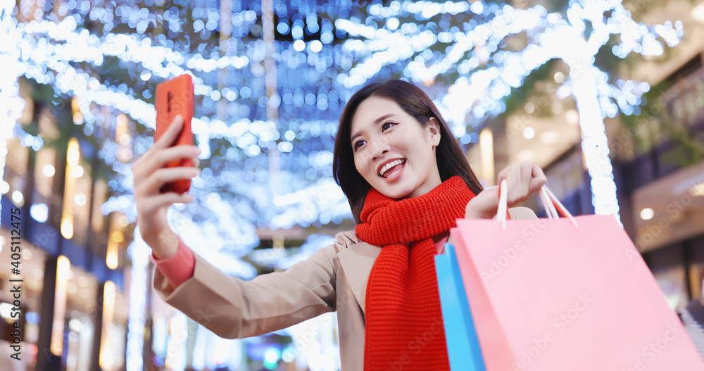 asian woman takes selfie