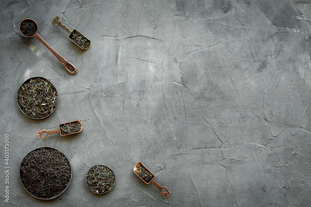 Set of dried tea leaves in bowls and spoons. Tea concept. Top view