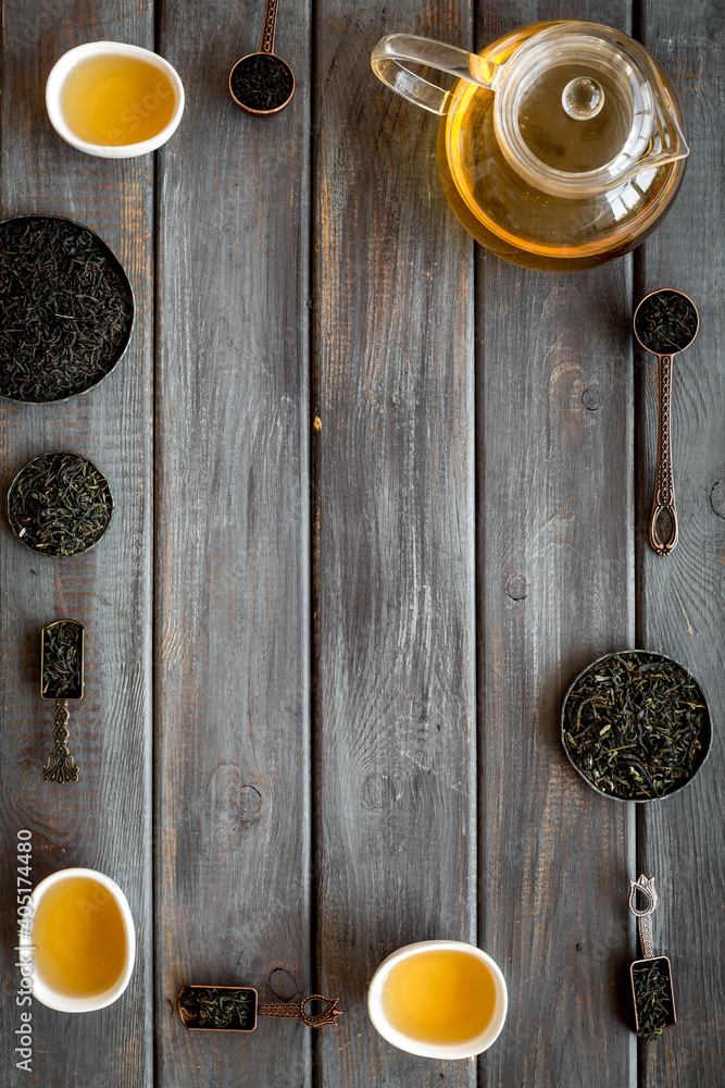 Frame of hot and dry tea in teapot and cups. Tea ceremony concept