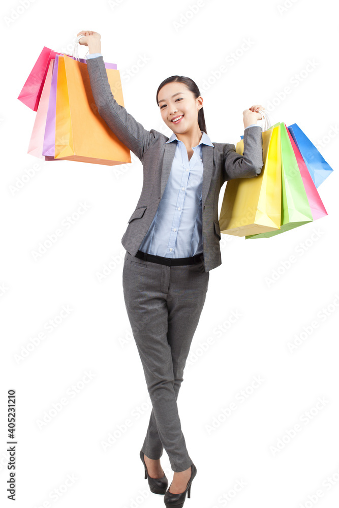 A happy Young woman holding shopping bags