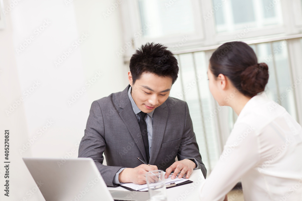 Group of business people discussing in office