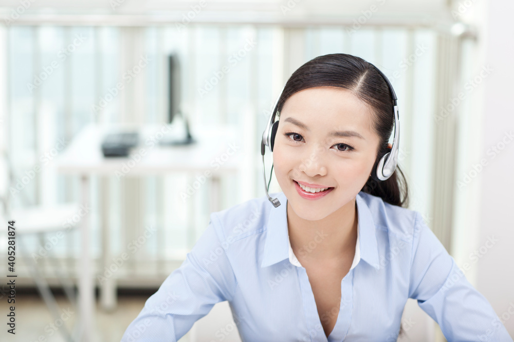 Young Female office worker wearing headset portrait