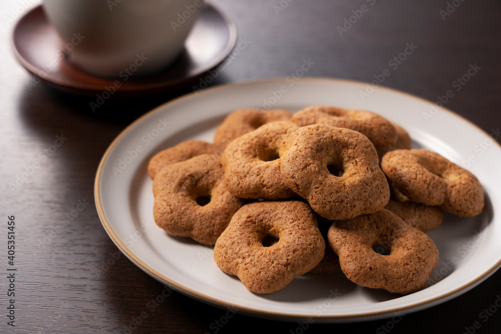 Japanese baked goods set against a wooden background. Sobaboro