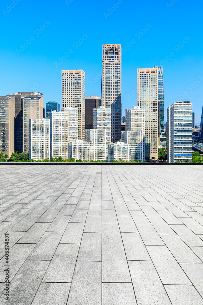 Empty square floor and modern city commercial buildings in Beijing,China.