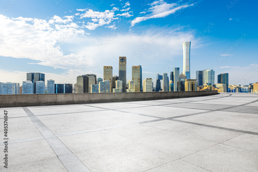 Empty square floor and modern city commercial buildings in Beijing,China.