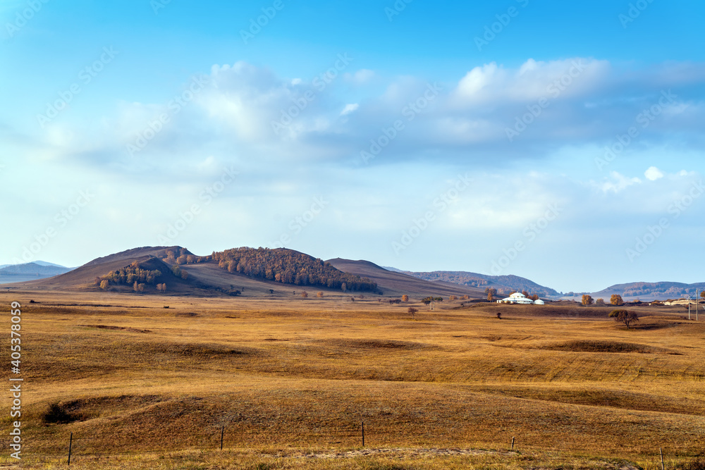 Sunrise, beautiful mountain views and grasslands.