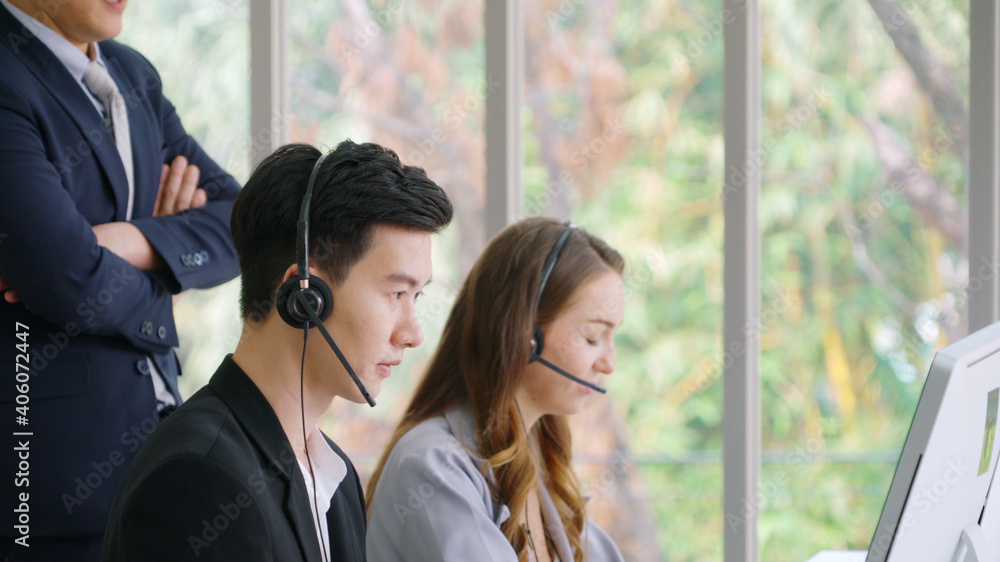 Business people wearing headset working in office to support remote customer or colleague. Call cent