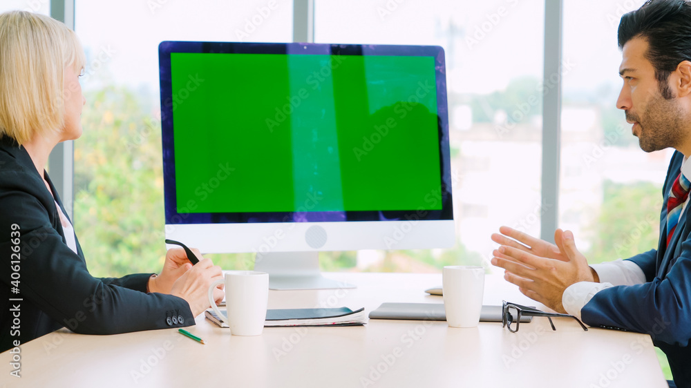 Business people in the conference room with green screen chroma key TV or computer on the office tab