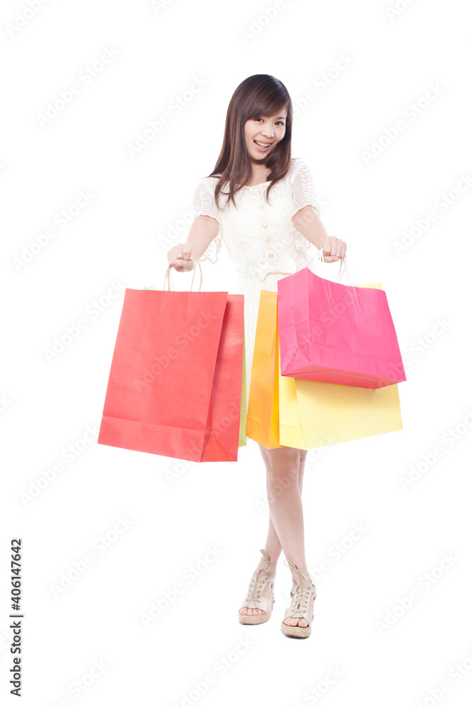 Portrait of a happy young woman shopping 