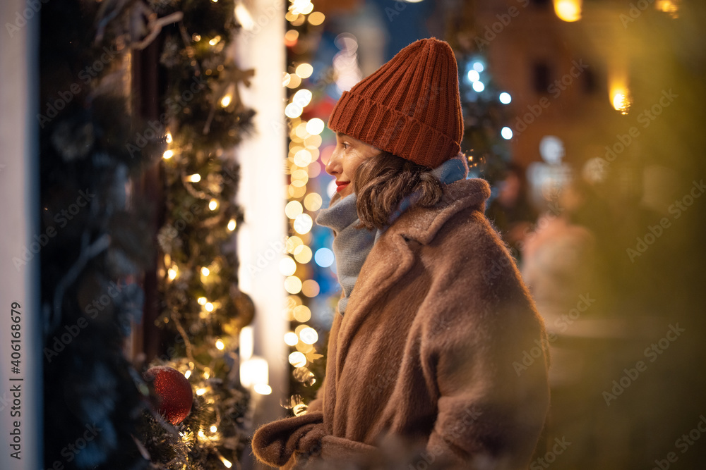 Woman looking at showcase in the Christmas market