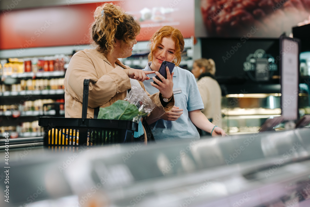 Shopper getting help from store assistant