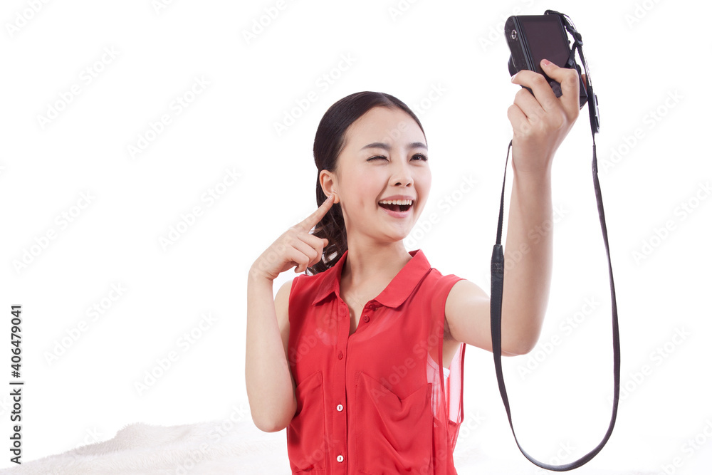 Portrait of a Young woman taking self portrait