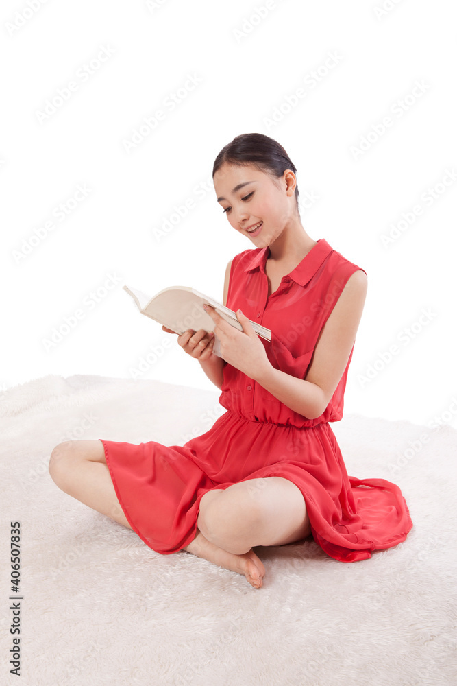 A Young woman reading in red dress