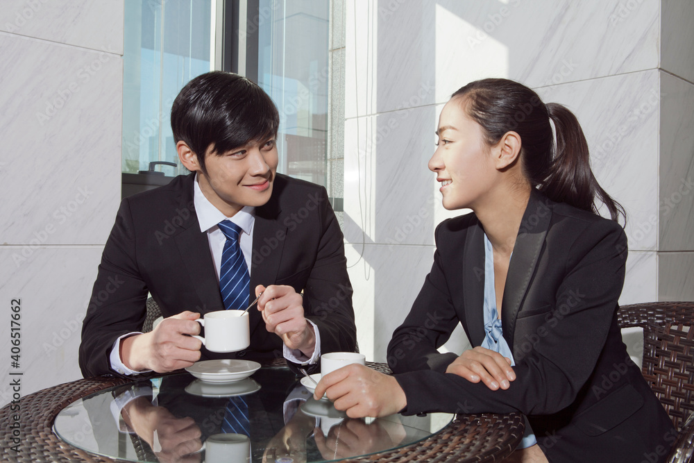 Business man and business woman discussing in office