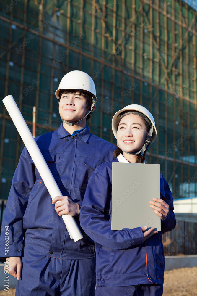 The Young Engineers working at construction field 