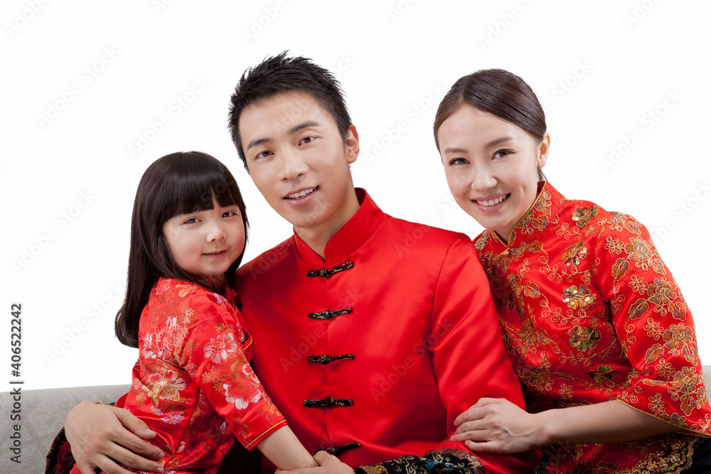 Portrait of daughter with parents in Tang suits 