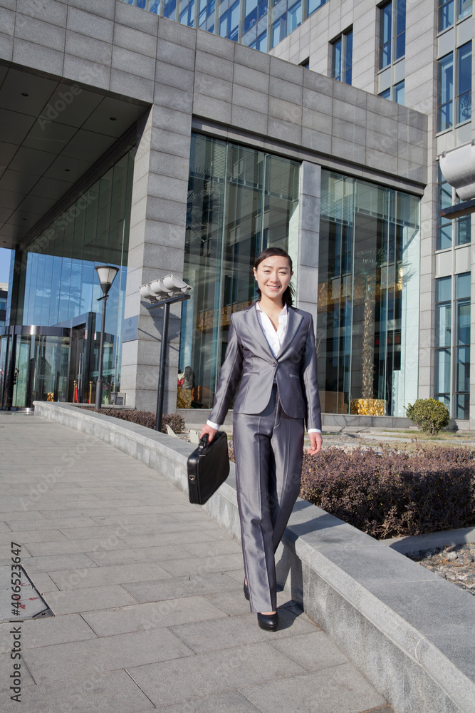 A young Business woman walking to work