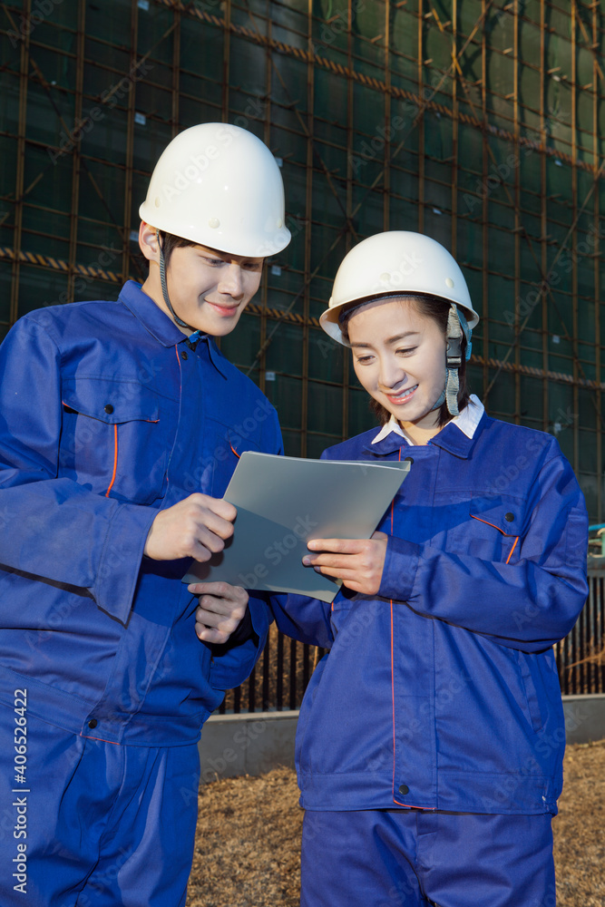 The Young Engineers working at construction field 