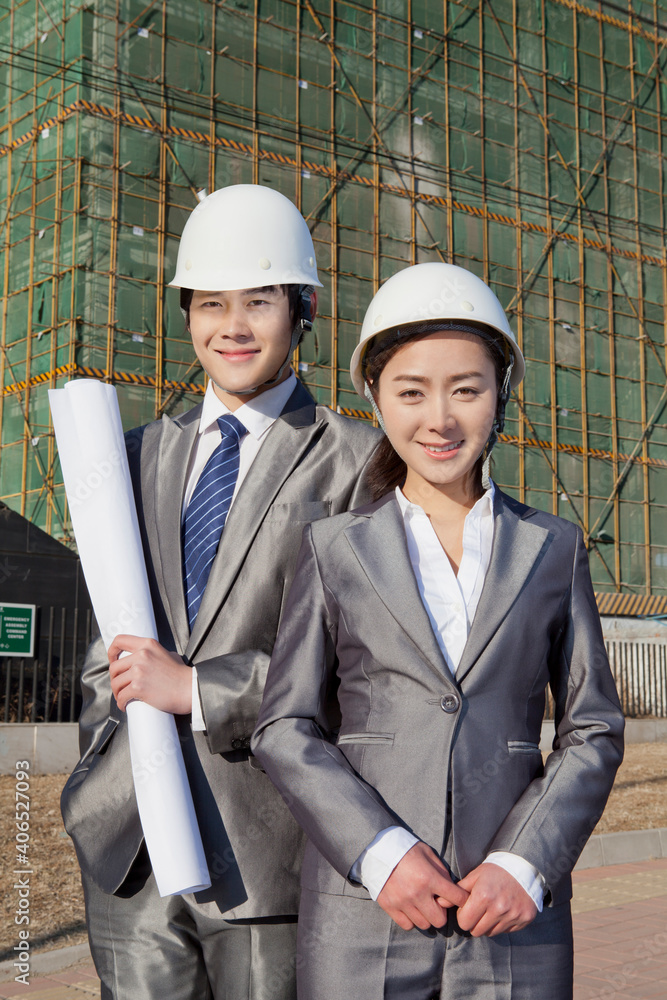 The Young Engineers working at construction field 