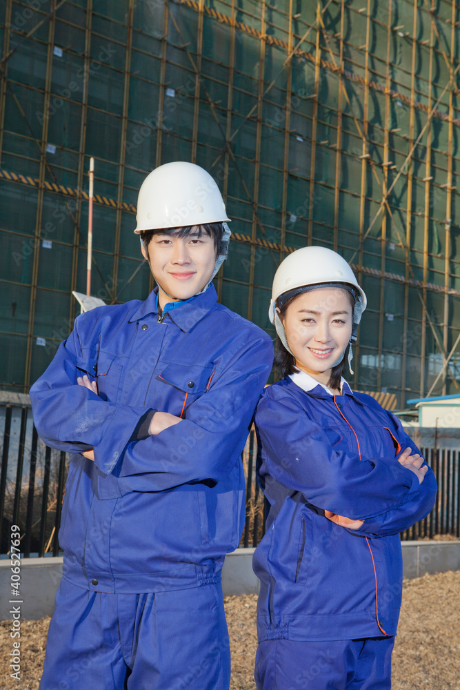 The Young Engineers working at construction field 