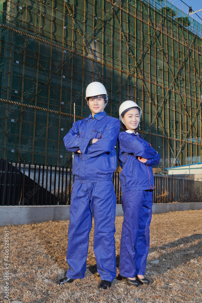 The Young Engineers working at construction field 