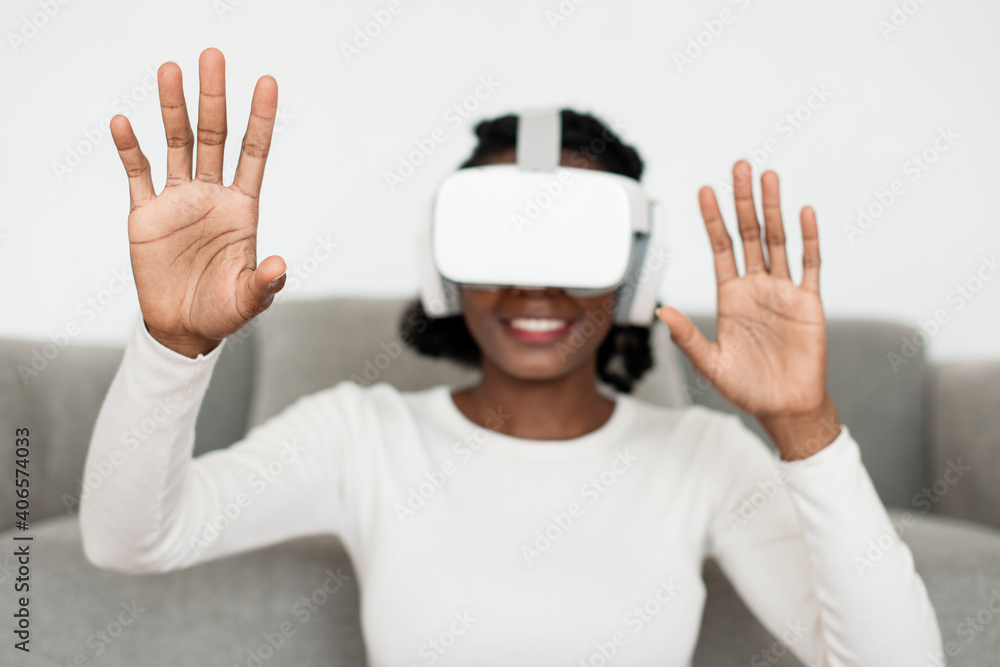 African American  woman experiencing VR simulation