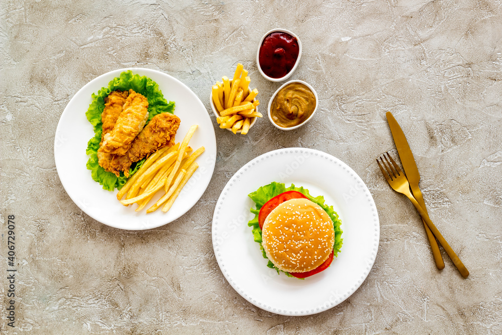 Overhead view of fast food - burger and french fries, flat lay