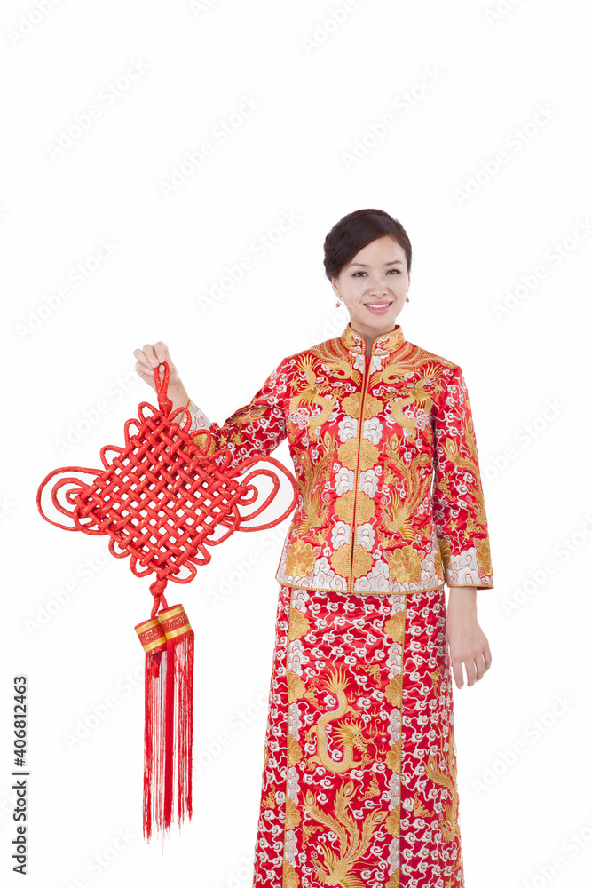 Portrait of young couple in Tang suit holding Chinese knot