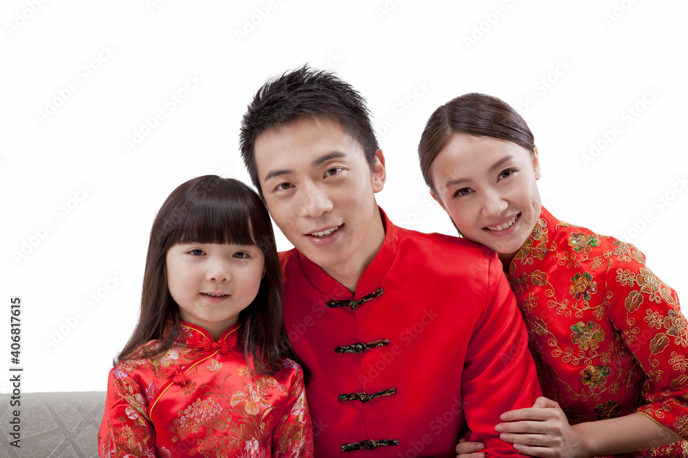 Portrait of daughter with parents in Tang suits 