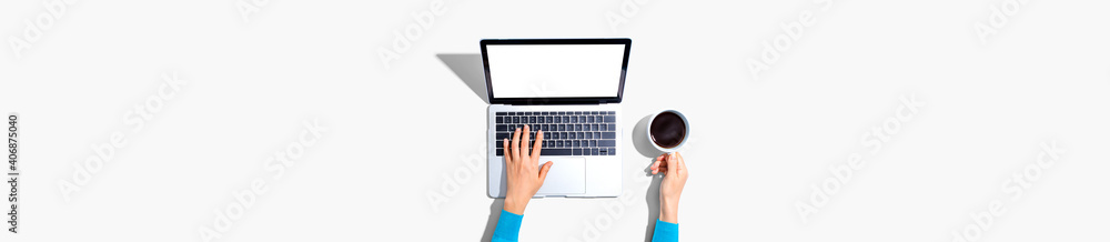 Person using a laptop computer from above