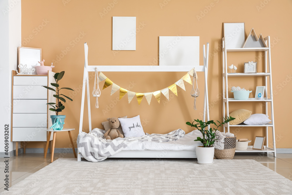 Interior of modern childrens room with stylish bed